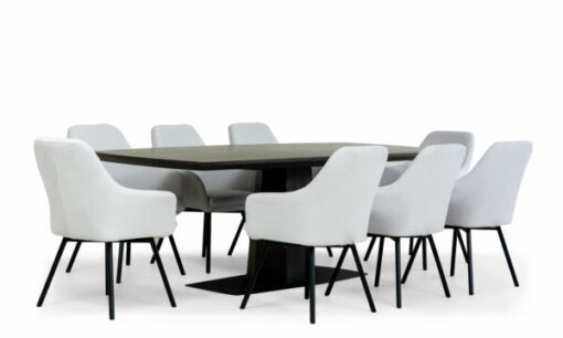 Mesa Comedor Nápoles con 8 Sillas Turín P/N de la marca Aristas vista en diagonal. La mesa tiene una forma rectangular de acabado liso en madera color Ceniza, y, las sillas Turín cuentan con un respaldo alto y acolchado de color Dickens Cuarzo.