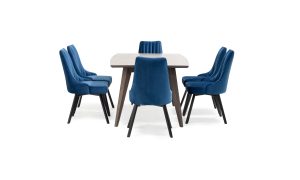 Mesa Comedor Genoa + 6 Sillas Florencia P/N de Aristas, vista en perspectiva lateral. La mesa destaca por su estructura en madera, con una superficie rectangular y patas anguladas y robustas. Las sillas Florencia presentan un respaldo alto de líneas elegantes y acabado en tela suave.