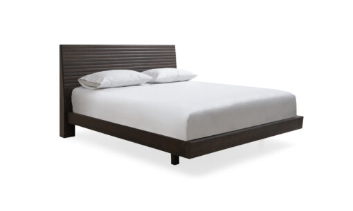 Vista diagonal de la cama Toronto Ares Chaflán de Aristas. Un diseño elegante y moderno que destaca por sus líneas rectas y su elegante estructura en madera color Olmo.